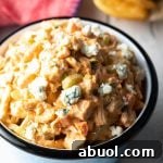 A bowl filled with an easy buffalo chicken salad recipe made with rotisserie chicken.