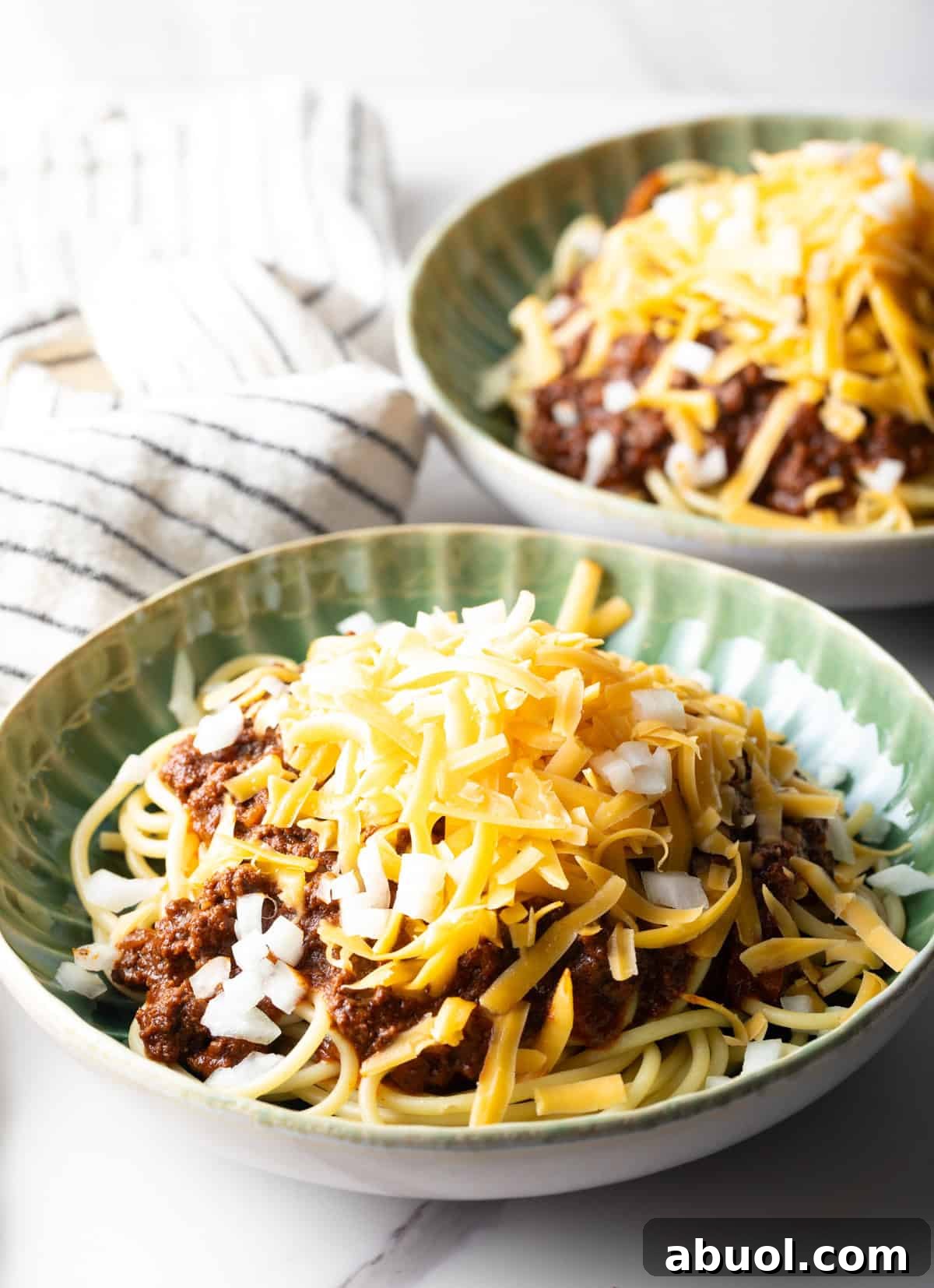 Two bowls filled with a homemade skyline chili recipe.