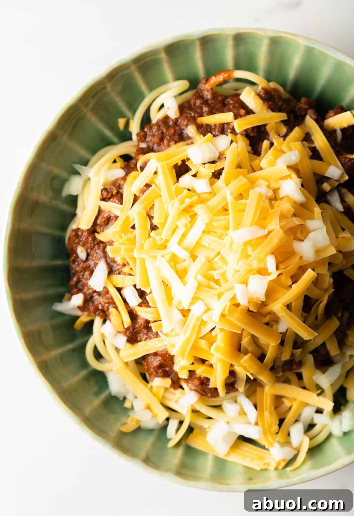 An overhead shot of a bowl of a Cincinnati chili recipe.